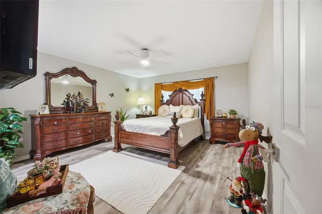 a bedroom with a bed and a dresser