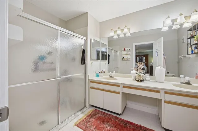 a bathroom with a sink vanity and a mirror