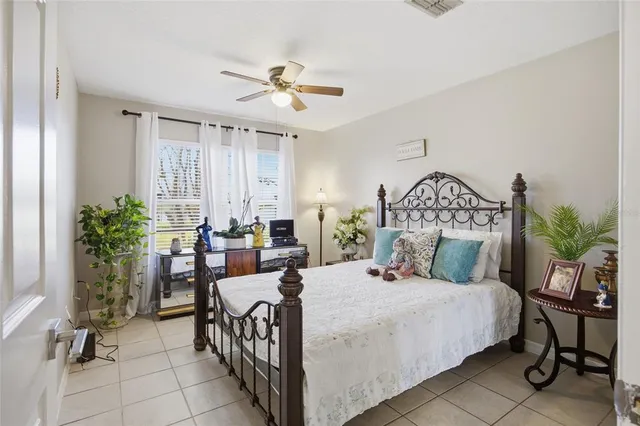 a bedroom with a bed and a table in it