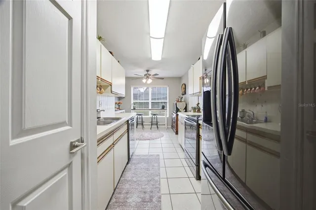 a kitchen with stainless steel appliances granite countertop refrigerator and a stove