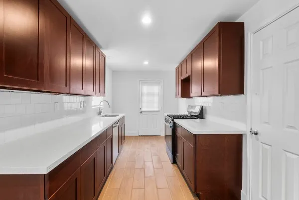 a kitchen with a sink and cabinets