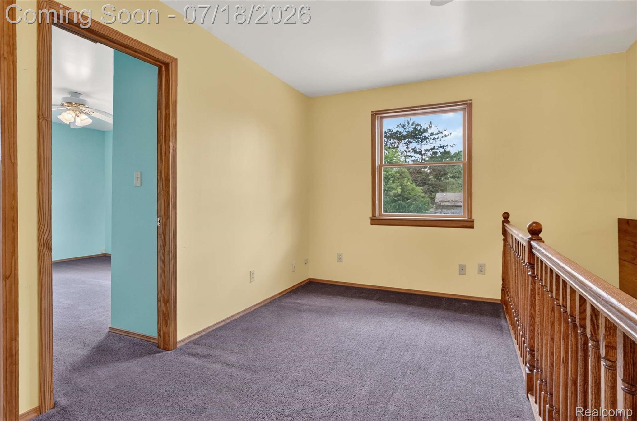 1437 East Cook Road Grand Blanc, MI 48439 - Photo 60 of 69 Upper-level space featuring light yellow walls and dark gray carpeting