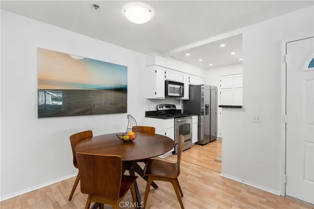 a kitchen with a table and chairs in it