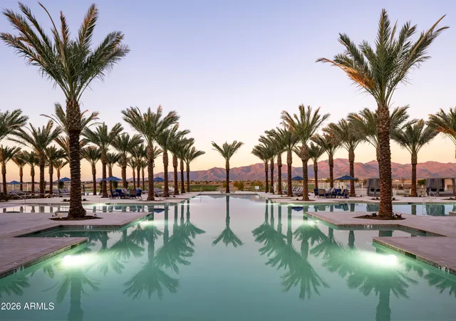 a view of house with yard and lake view