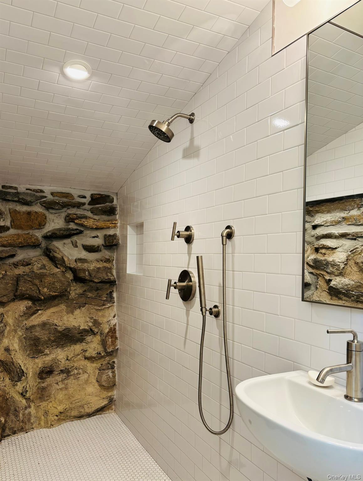 38 A Creemer Road Armonk, NY 10504 - Photo 13 of 23 A special feature in the shower: a river rock foundation wall.
