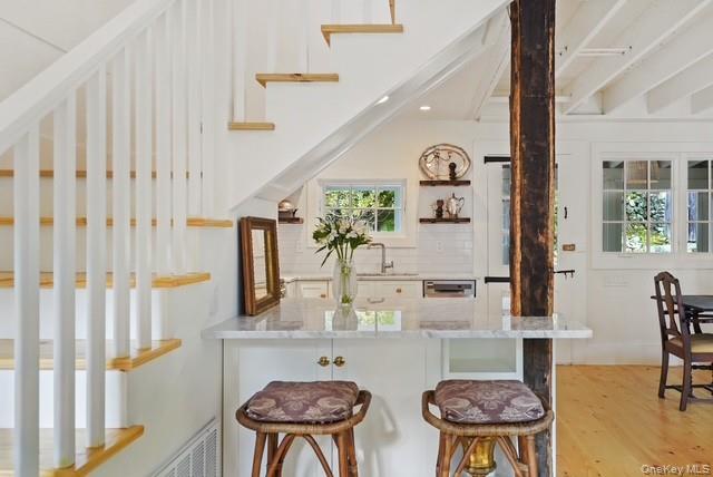 38 A Creemer Road Armonk, NY 10504 - Photo 15 of 23 Another view of the breakfast island near the stair to the second level.