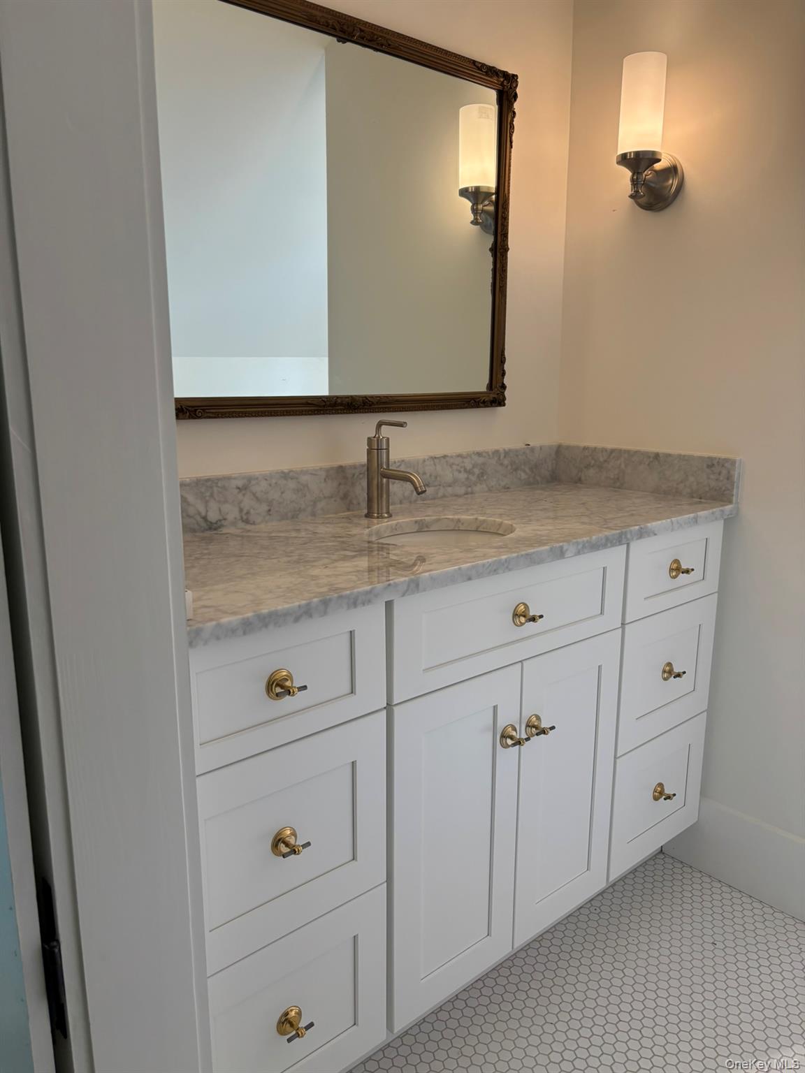 38 A Creemer Road Armonk, NY 10504 - Photo 19 of 23 The primary bath includes a quartz vanity top, tiled walk-in shower and laundry.
