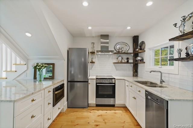 38 A Creemer Road Armonk, NY 10504 - Photo 7 of 23 The renovated kitchen includes new stainless steel appliances and a breakfast island.