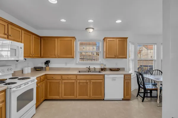 a kitchen that has a sink and a stove in it