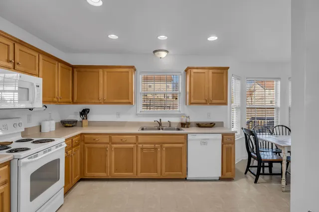 a kitchen that has a sink and a stove in it