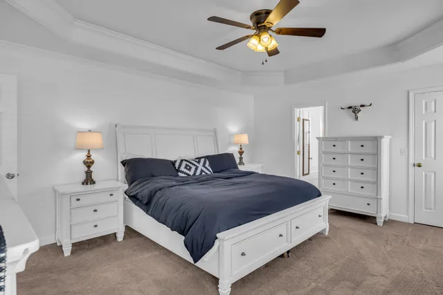 a spacious bedroom with a bed and a closet