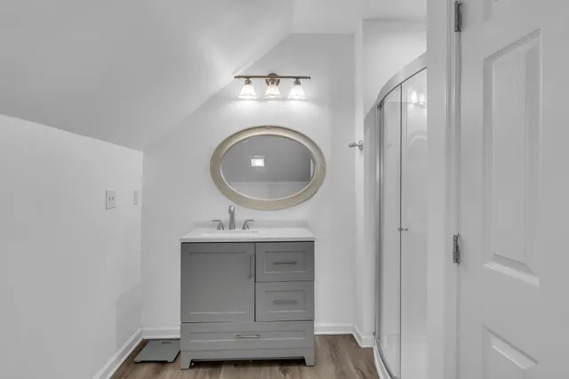 a bathroom with a mirror and a sink