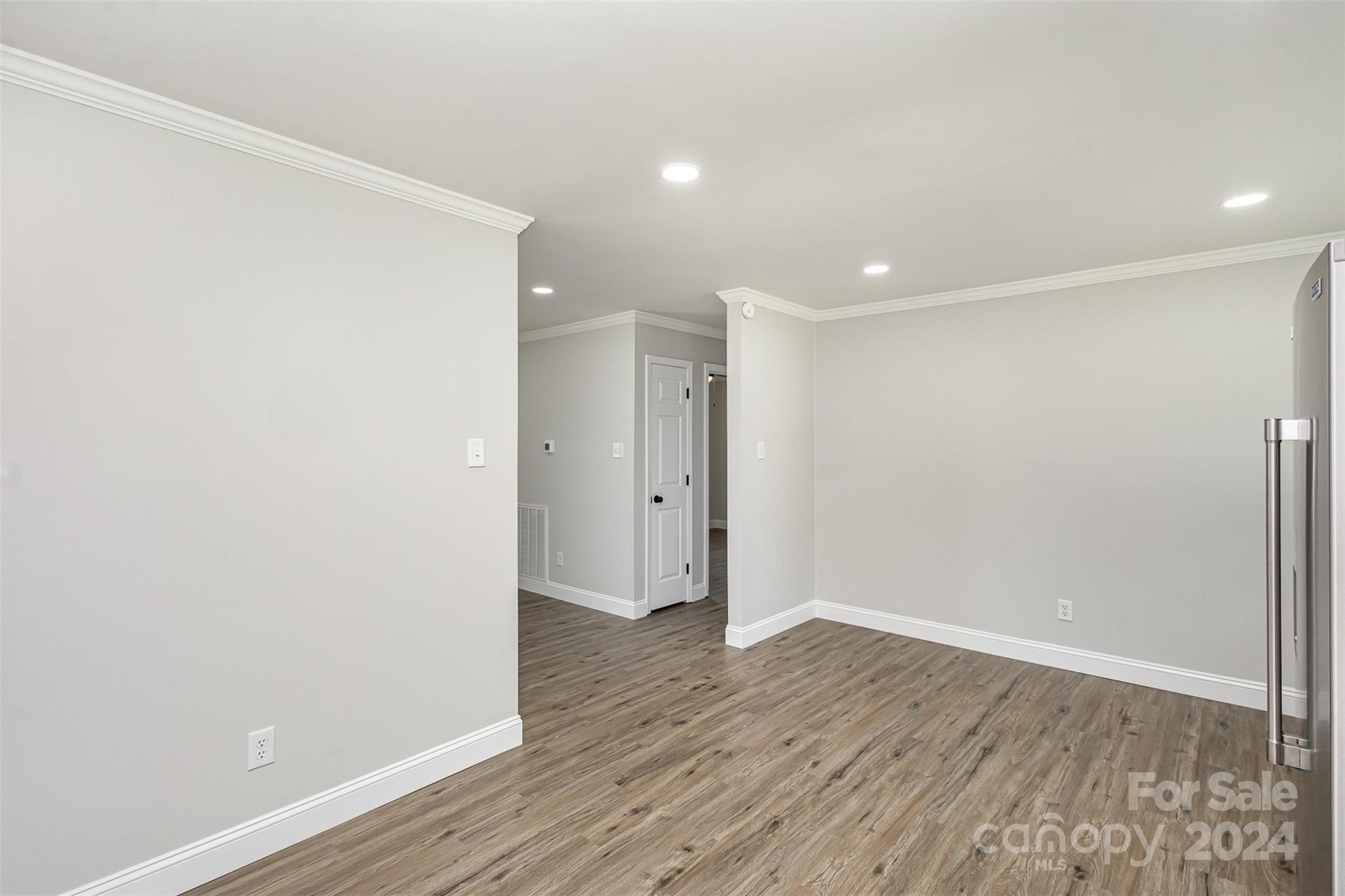 613 Unique Street Chester, SC 29706 - Photo 15 of 27 a view of an empty room with wooden floor