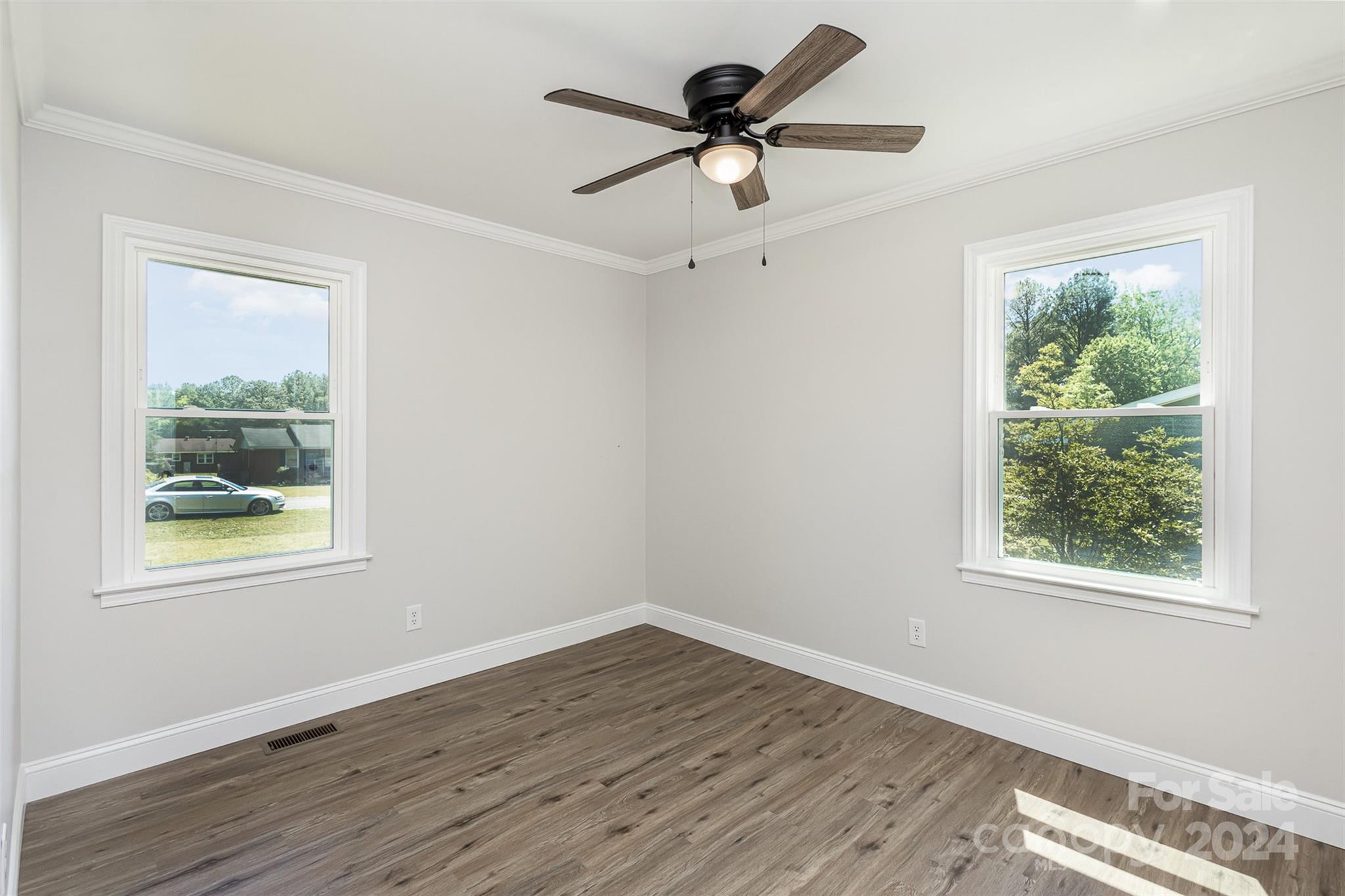 613 Unique Street Chester, SC 29706 - Photo 17 of 27 a view of empty room with wooden floor and window