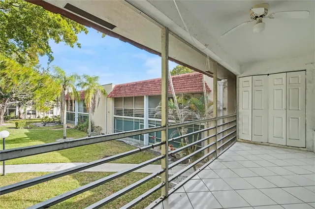 a view of a room with wooden floor and windows
