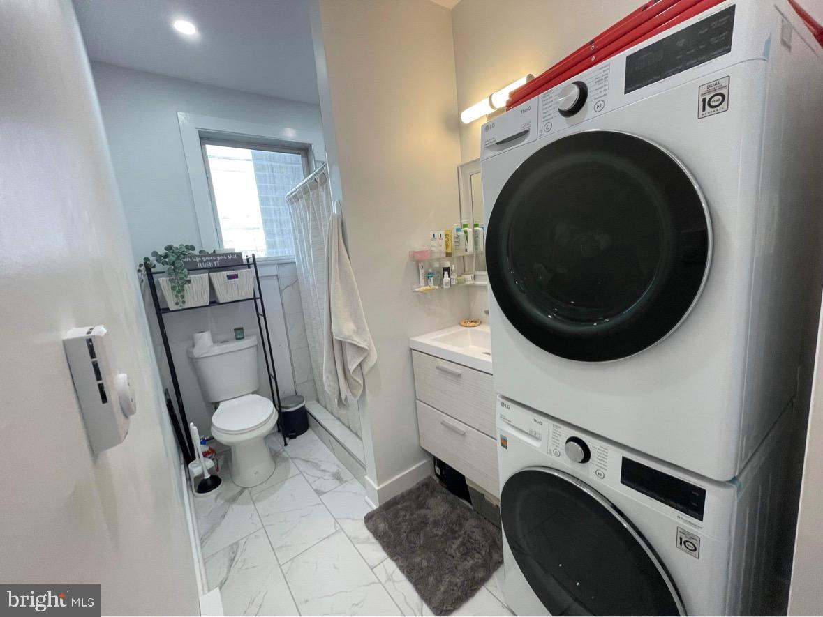 1501 South 12th Street, Unit 3F Philadelphia, PA 19147 - Photo 19 of 23 a utility room with dryer and washer
