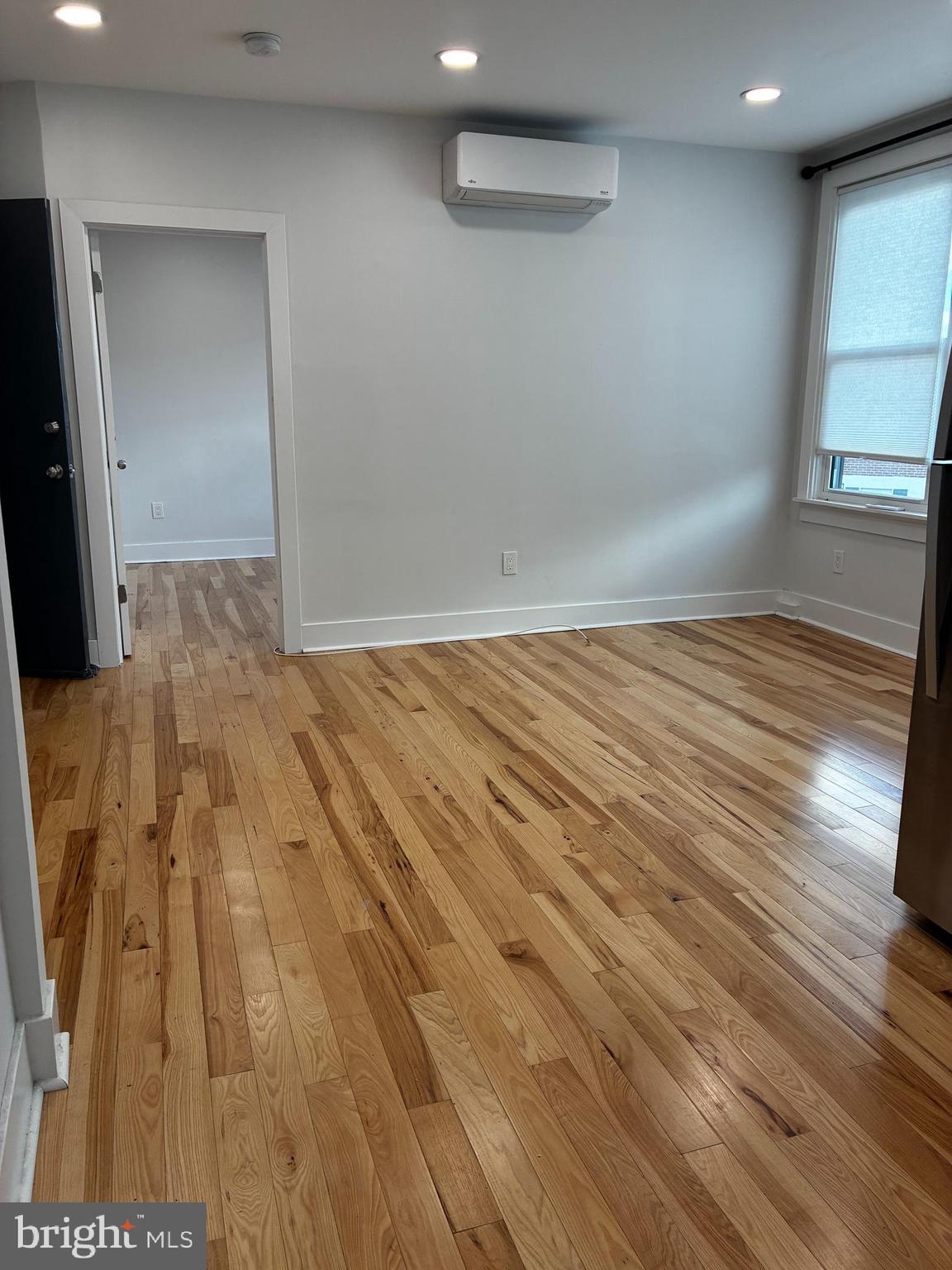 1501 South 12th Street, Unit 3F Philadelphia, PA 19147 - Photo 2 of 23 a view of empty room with wooden floor