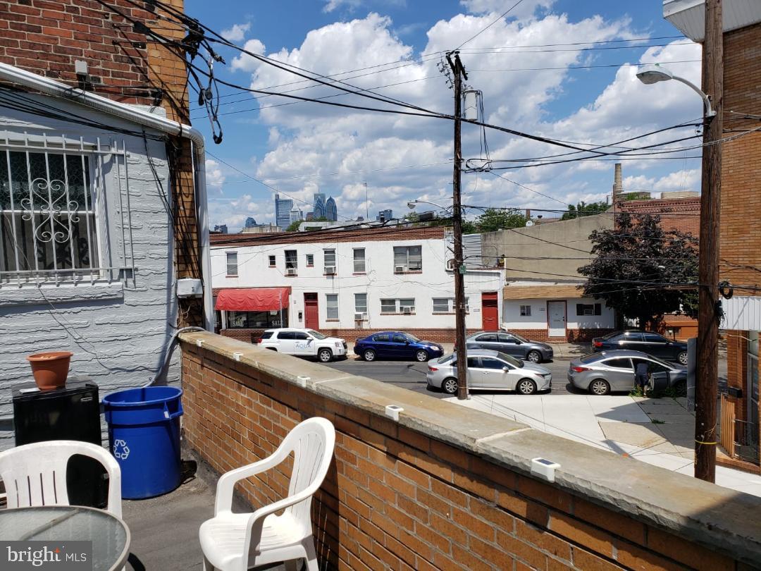 1501 South 12th Street, Unit 3F Philadelphia, PA 19147 - Photo 22 of 23 a view of a balcony with chairs and potted plants