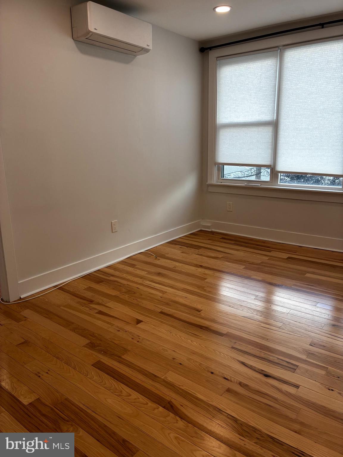 1501 South 12th Street, Unit 3F Philadelphia, PA 19147 - Photo 4 of 23 a view of empty room with wooden floor and fan