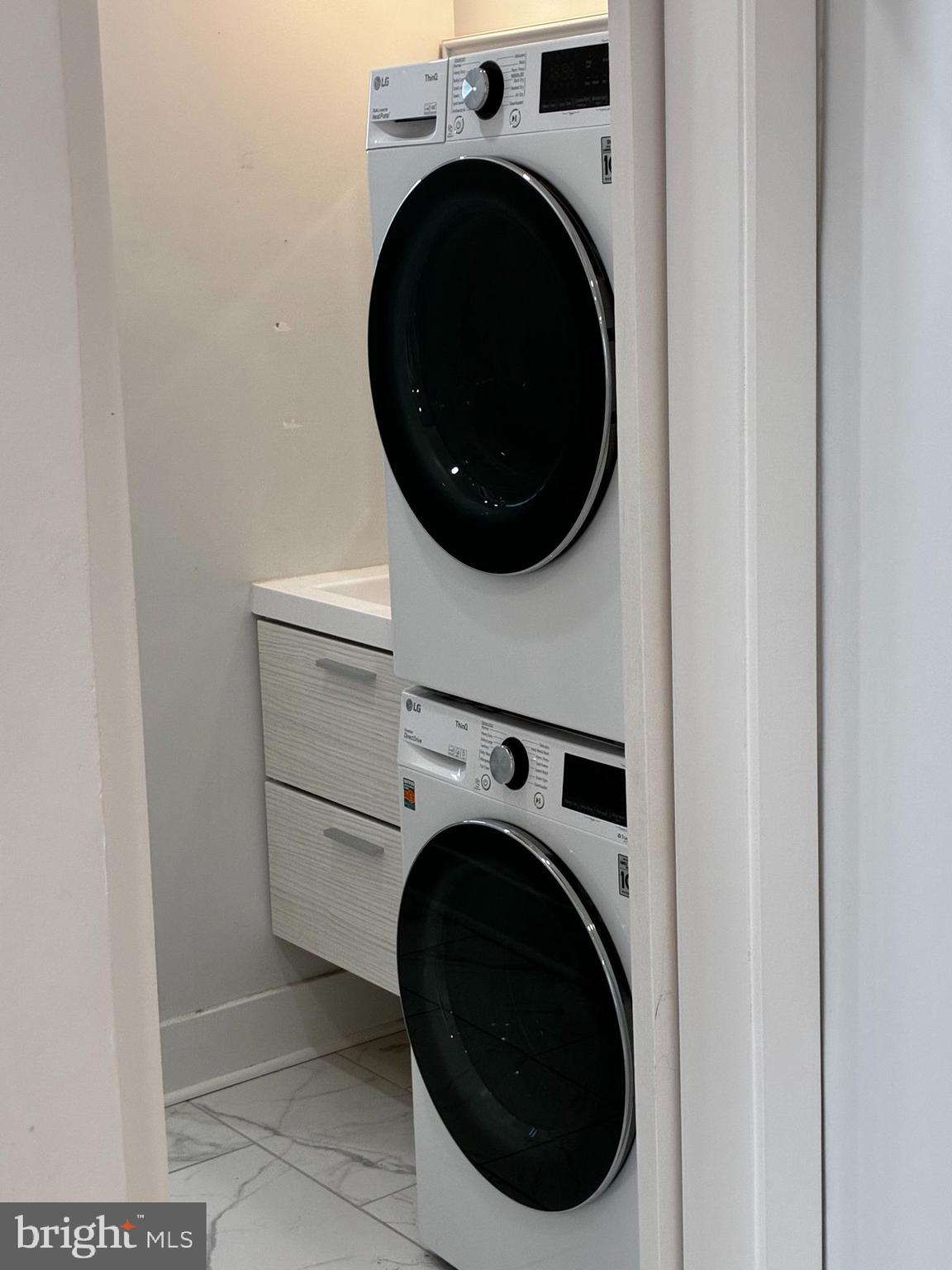 1501 South 12th Street, Unit 3F Philadelphia, PA 19147 - Photo 8 of 23 a close up view of a washer and dryer