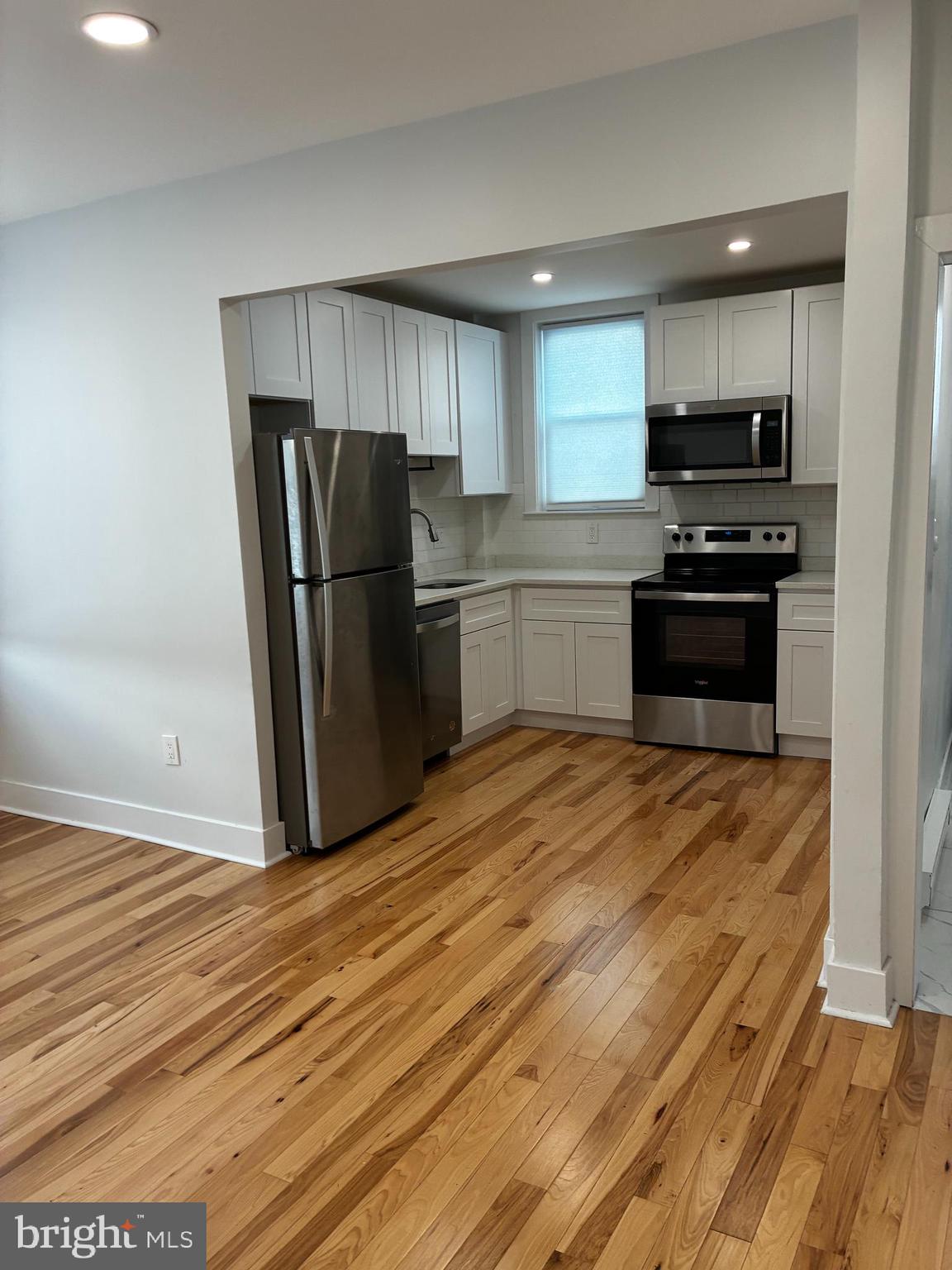 1501 South 12th Street, Unit 3F Philadelphia, PA 19147 - Photo 9 of 23 a kitchen with a refrigerator and a stove top oven