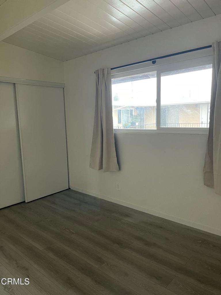 712 South G Street, Unit E Oxnard, CA 93030 - Photo 10 of 12 a view of wooden floor and brick walls