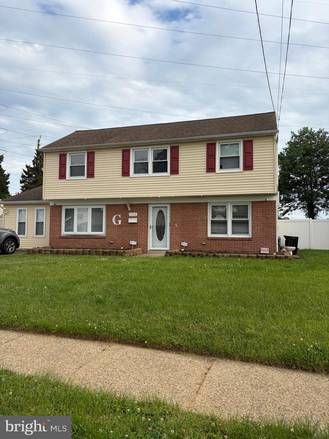 7404 Wyndam Road Pennsauken, NJ 08110 - Photo 1 of 50 a front view of a house with a garden