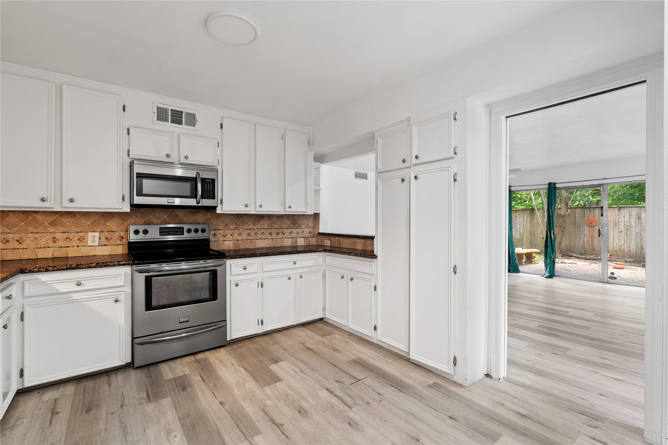 6303 Crab Orchard Road, Unit 3 Houston, TX 77057 - Photo 15 of 30 See how the kitchen opens directly to the living area and the outdoor views. This layout ensures you are always part of the conversation, whether you're prepping dinner or grabbing a drink before heading out to the patio.