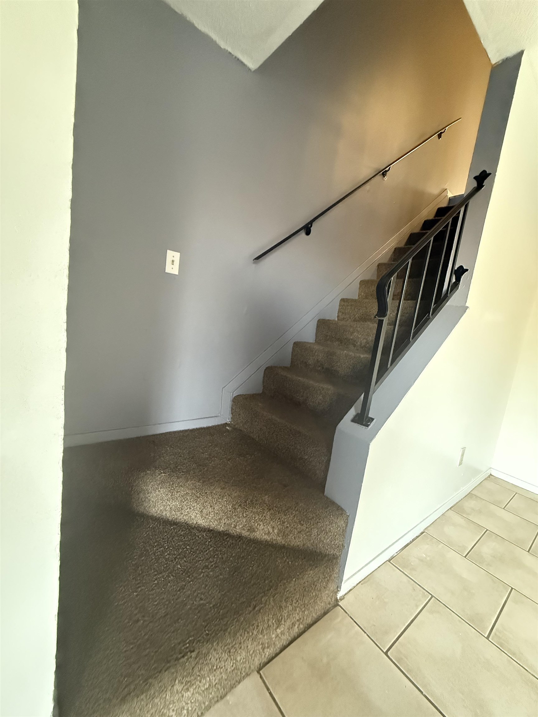 3091 Range Line Road Memphis, TN 38127 - Photo 7 of 13 Stairs featuring tile patterned flooring and baseboards