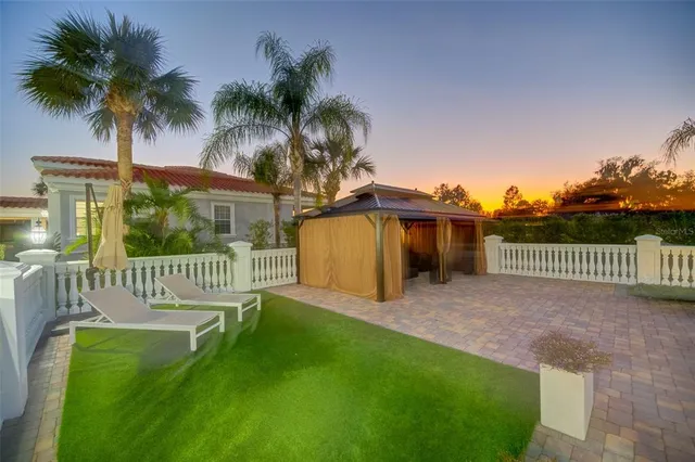 a living room with furniture ceiling fan and a window