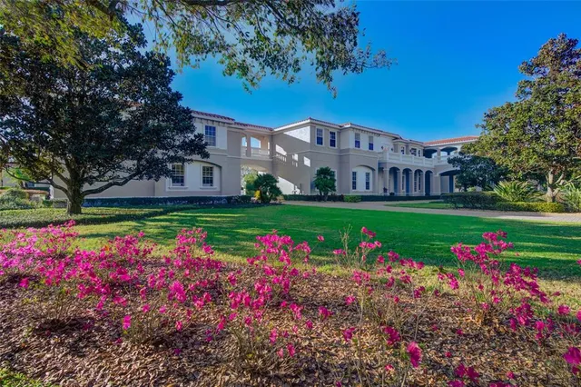 a living room with furniture a couch and a chandelier