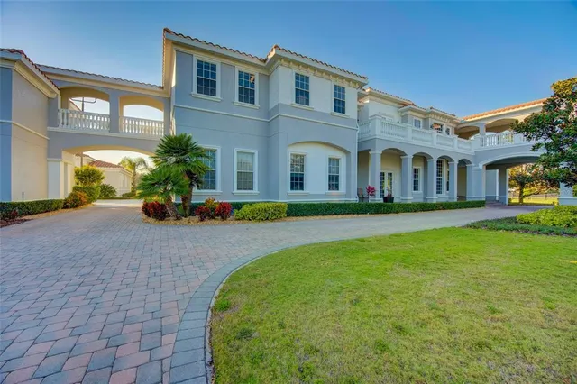 a bathroom with a granite countertop sink a toilet and a mirror