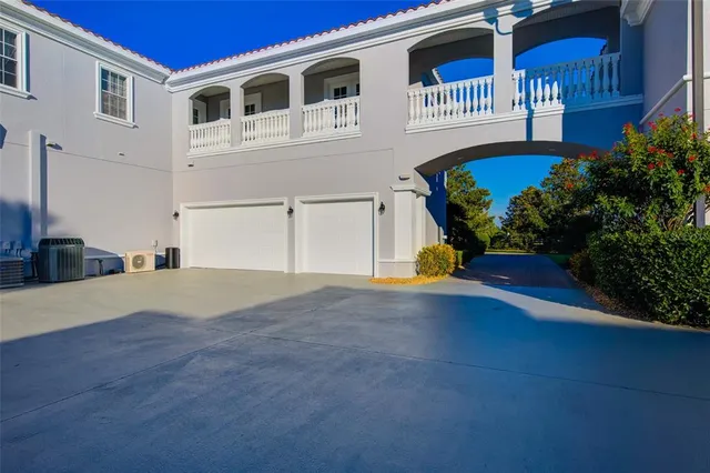 a bedroom with a bed and a flat tv screen on dresser