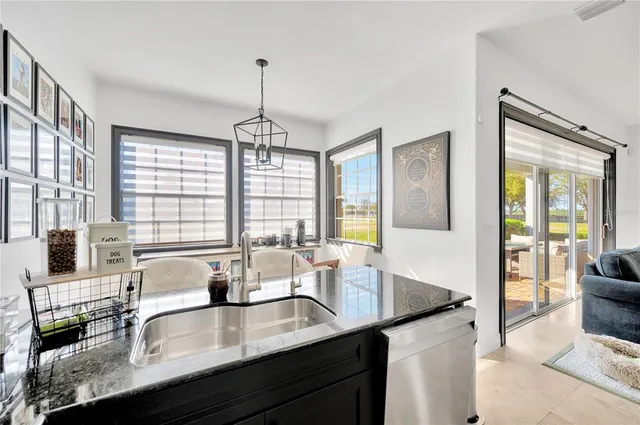 an aerial view of a house with swimming pool a fire pit and outdoor seating