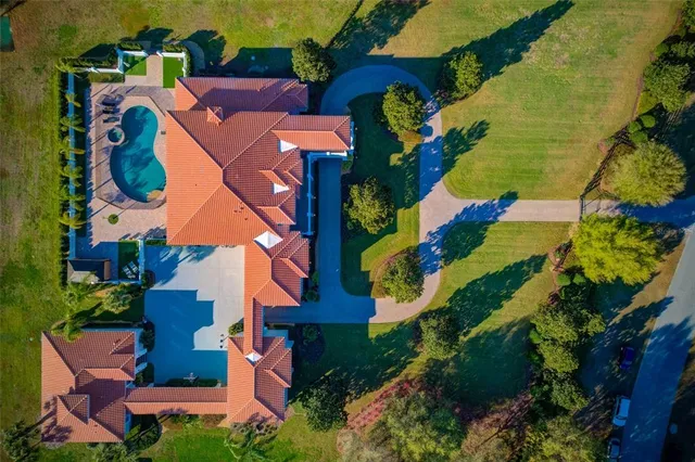 a view of a livingroom with a fireplace and chandelier