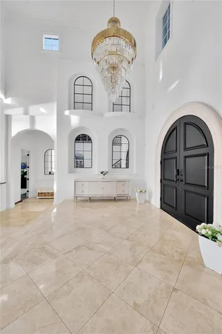 a kitchen that has a lot of cabinets a sink and a stove in it