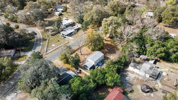an aerial view of residential house with outdoor space