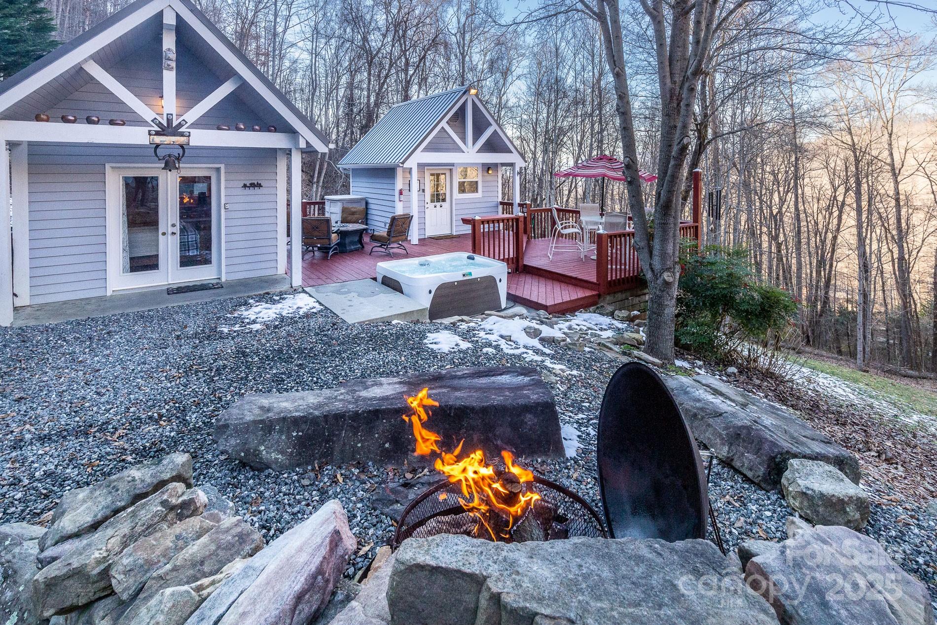 283 Walnut Cv Ridge Bryson City, NC 28713 - Photo 11 of 42 a front view of a house with a yard and garage