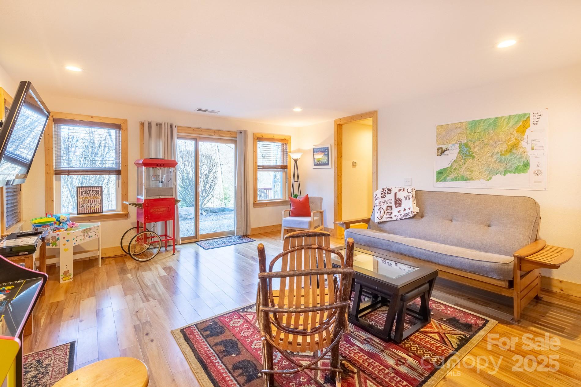 283 Walnut Cv Ridge Bryson City, NC 28713 - Photo 17 of 42 a living room with furniture and a wooden floor