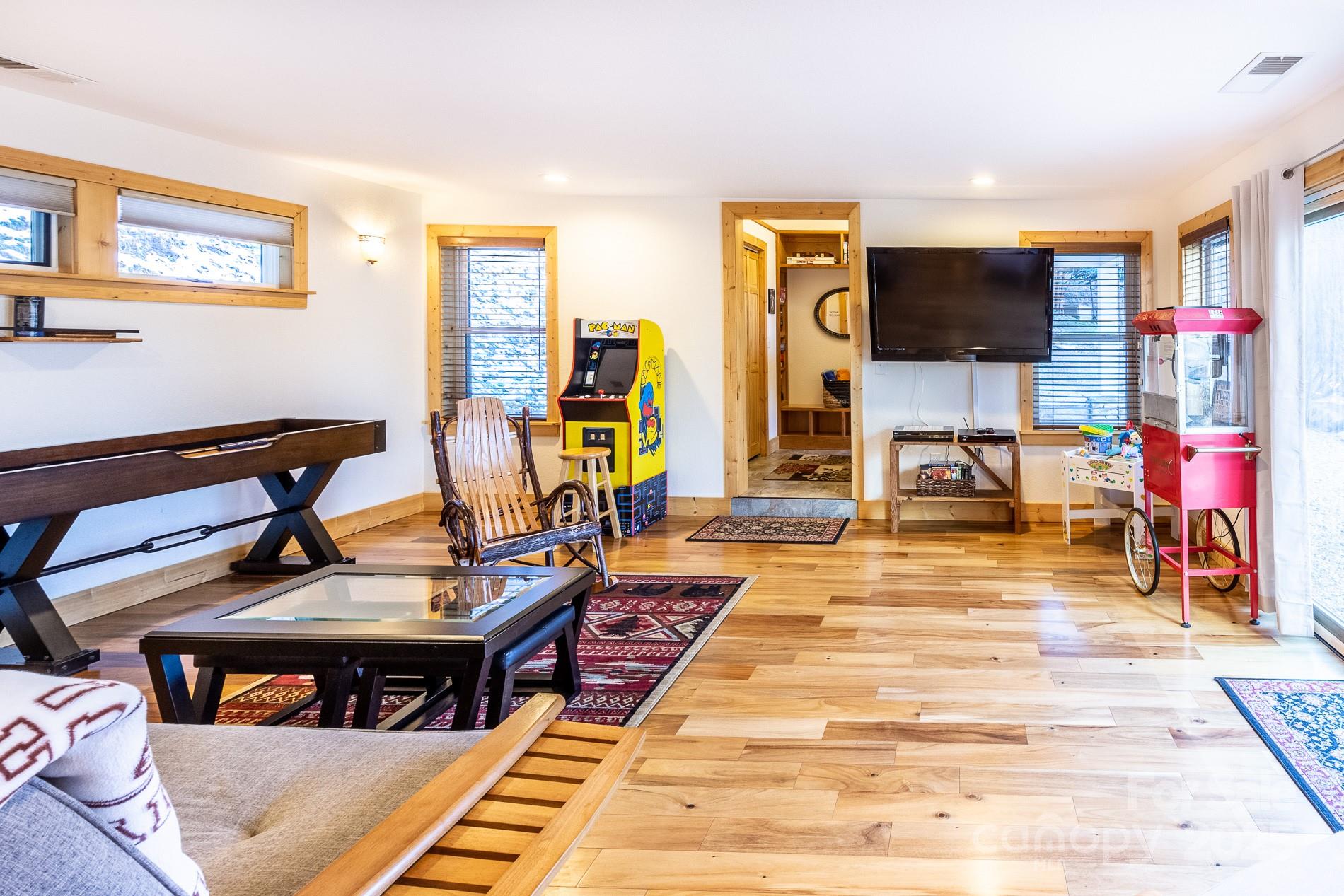 283 Walnut Cv Ridge Bryson City, NC 28713 - Photo 18 of 42 a view of a livingroom with furniture and a flat screen tv