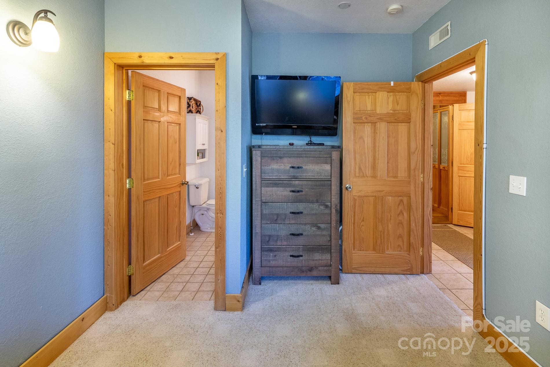 283 Walnut Cv Ridge Bryson City, NC 28713 - Photo 24 of 42 an empty room with closet and wooden floor