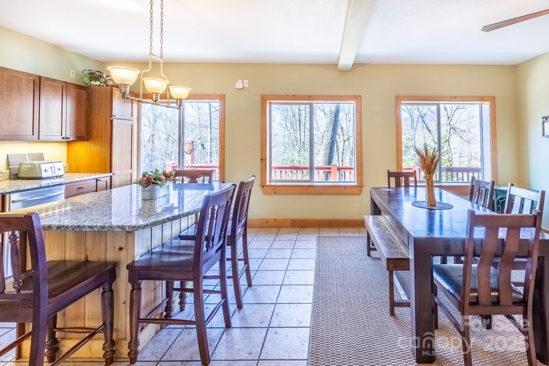 283 Walnut Cv Ridge Bryson City, NC 28713 - Photo 28 of 42 a view of a dining room with furniture window and wooden floor