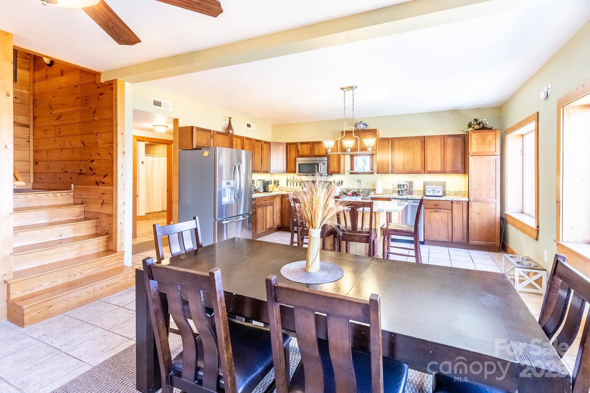 283 Walnut Cv Ridge Bryson City, NC 28713 - Photo 31 of 42 a dining room with stainless steel appliances a table and chairs