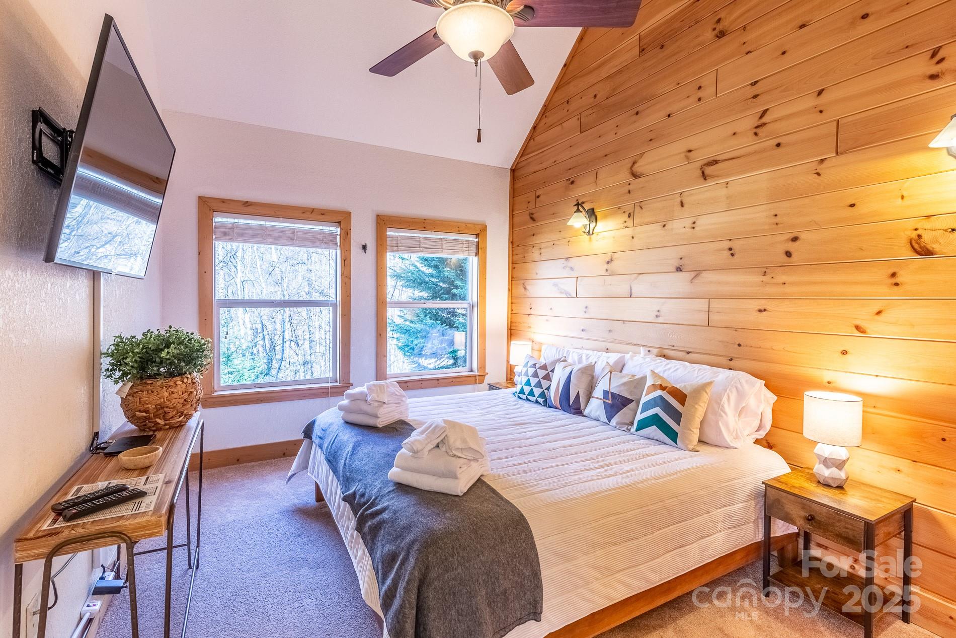 283 Walnut Cv Ridge Bryson City, NC 28713 - Photo 36 of 42 a bedroom with a bed and wooden floor