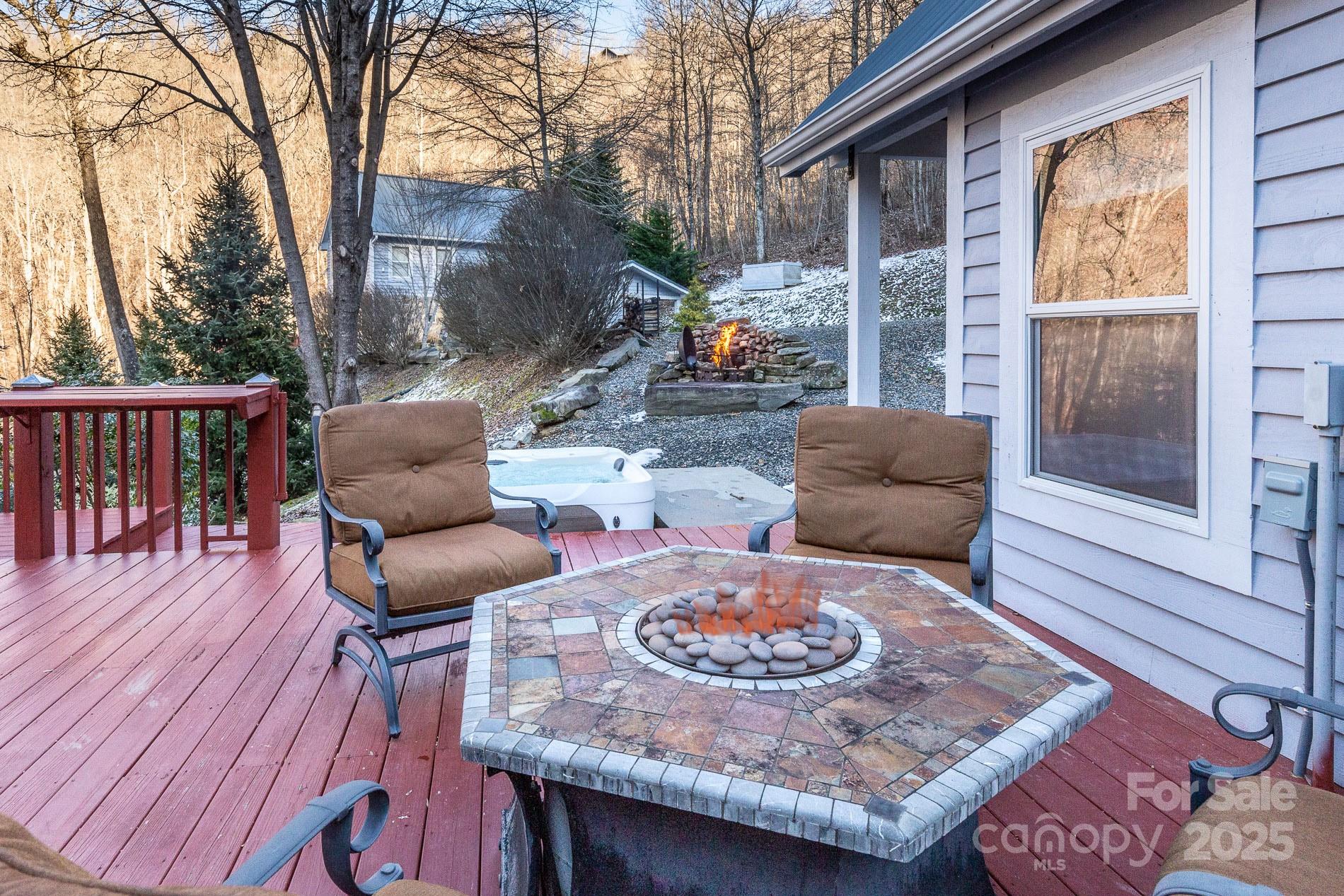 283 Walnut Cv Ridge Bryson City, NC 28713 - Photo 42 of 42 a outdoor space with patio the couches and a dining table with garden view
