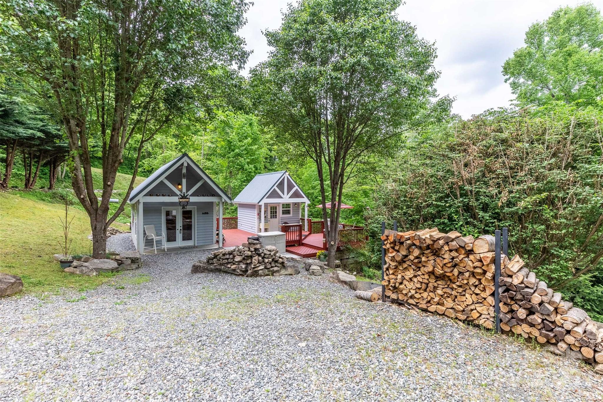 283 Walnut Cv Ridge Bryson City, NC 28713 - Photo 10 of 42 a view of a large house with a yard and large trees