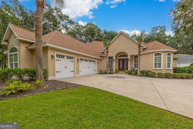 front view of a house with a yard