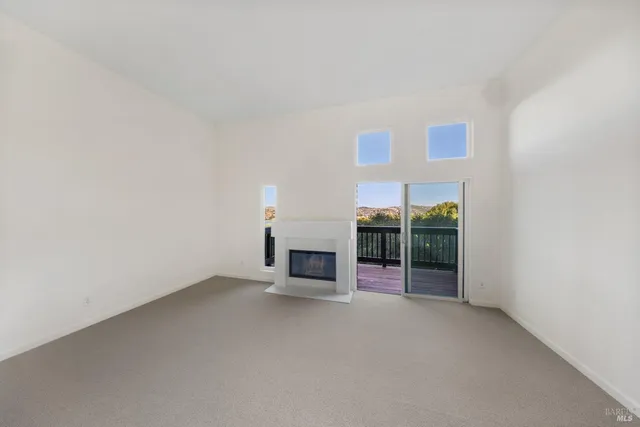 a view of an empty room with a fireplace