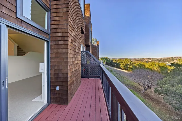 a balcony with an outdoor space