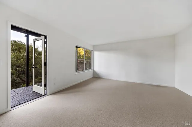 an empty room with windows